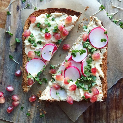 Hummus on Toasted Rye With Pomegranate Seeds, Radish & Cress